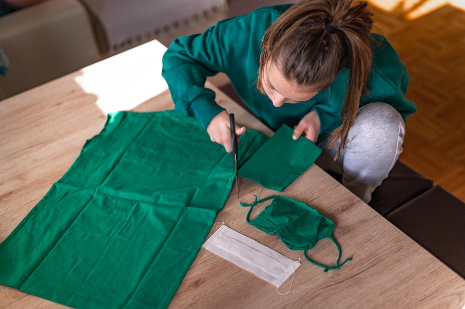 Girl cutting fabric