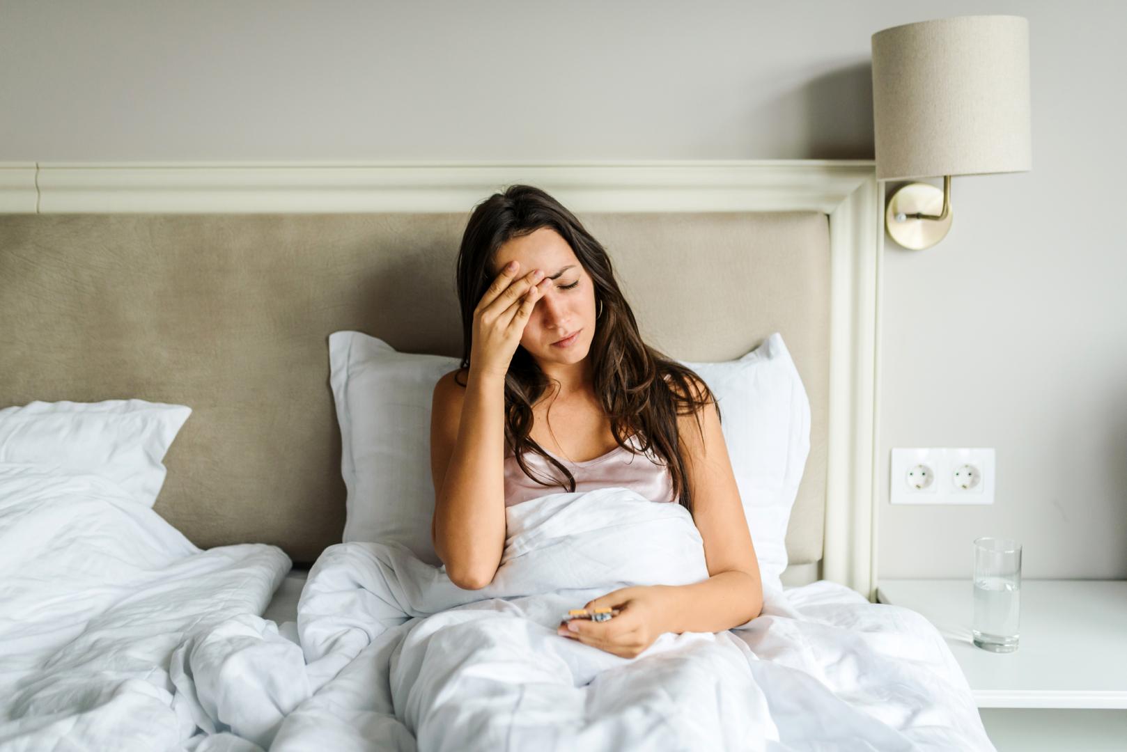 Woman sick in bed