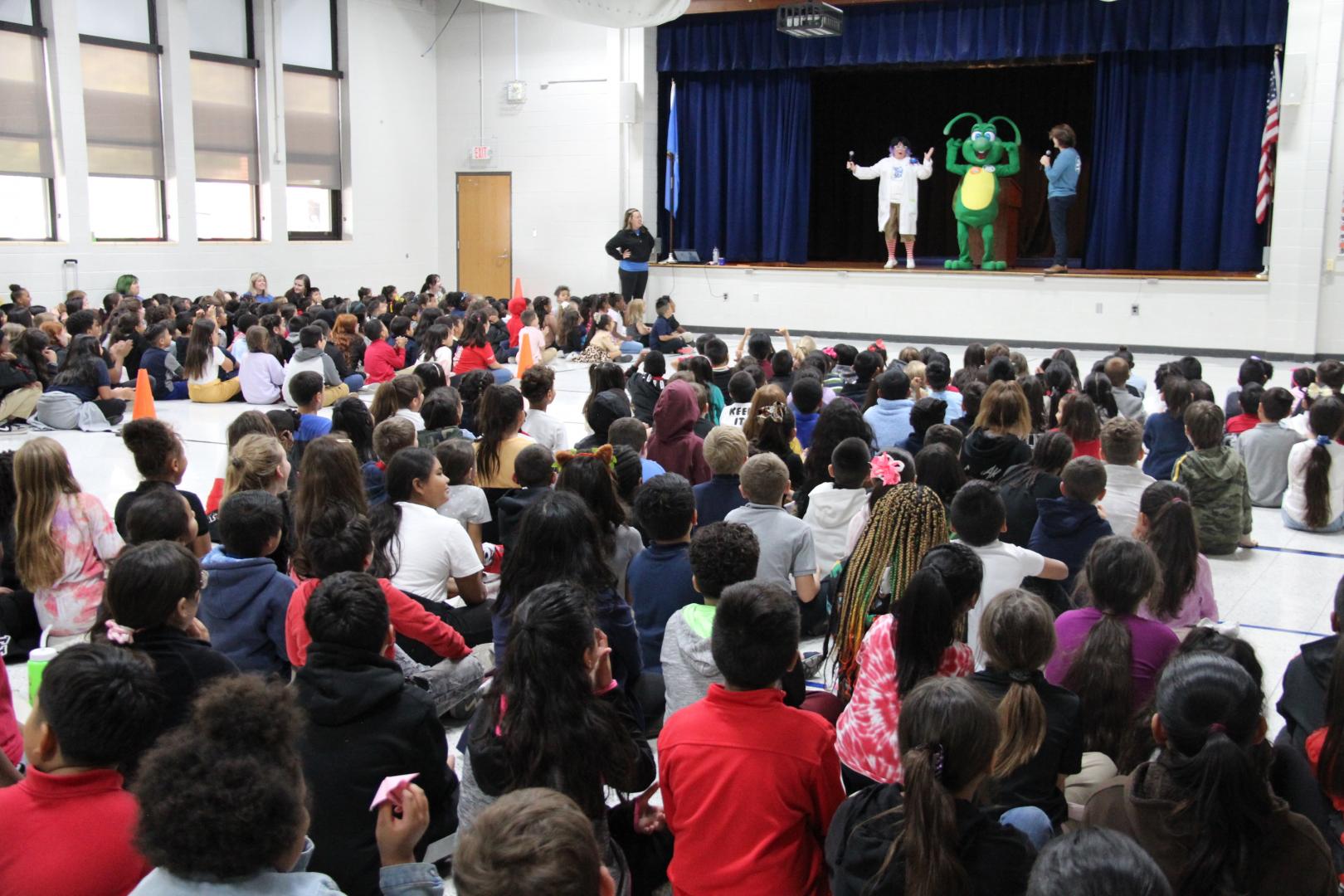 Kids watching people on a stage