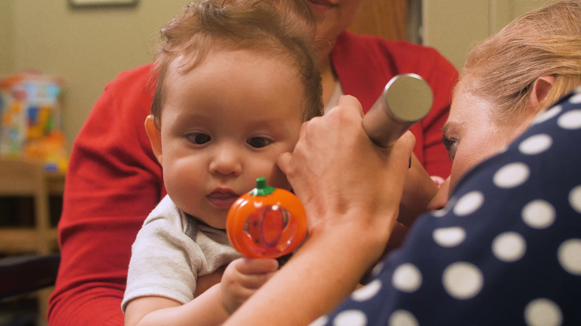 Baby being checked by health care worker