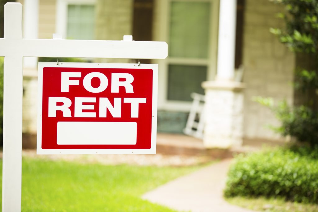 For rent sign in front of house