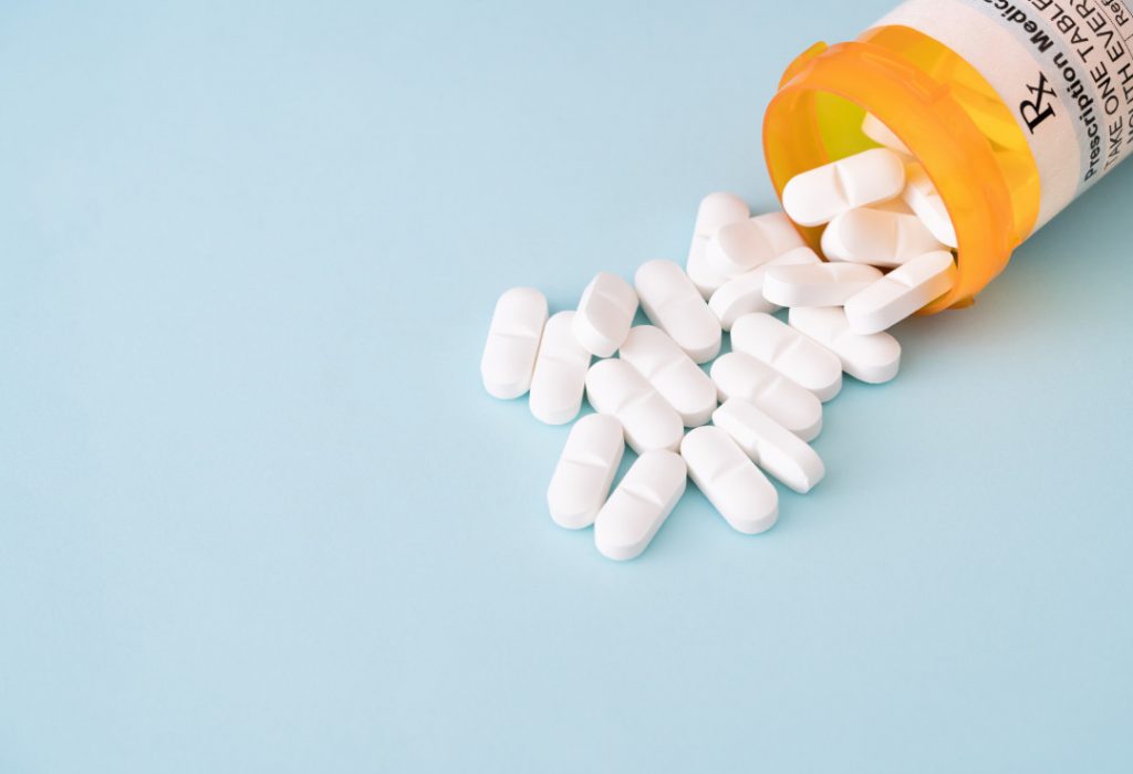 Pills spilling from a bottle